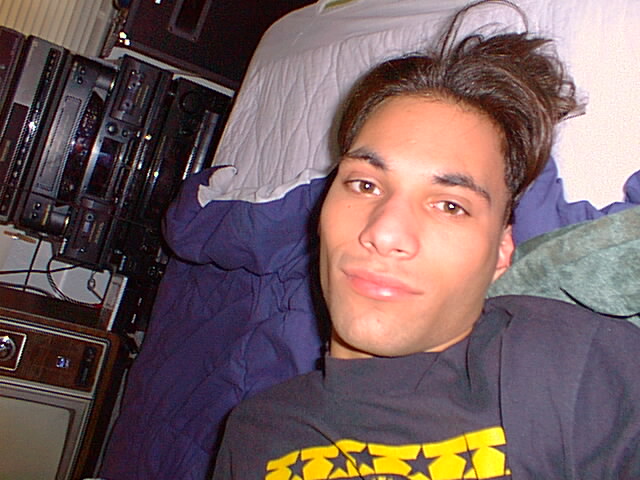 Picture of 'DJ' Brian from
August 29, 1999 when he decided to take
a lot of pictures of himself lying on
his bed.